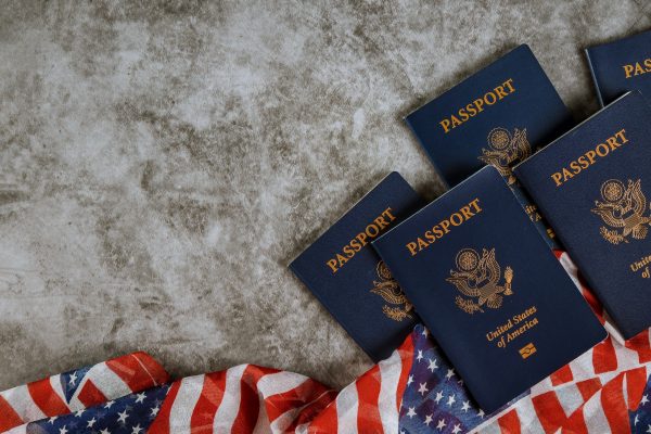 american-passports-and-flag-with-the-symbols-of-the-united-states-of-america-.jpg